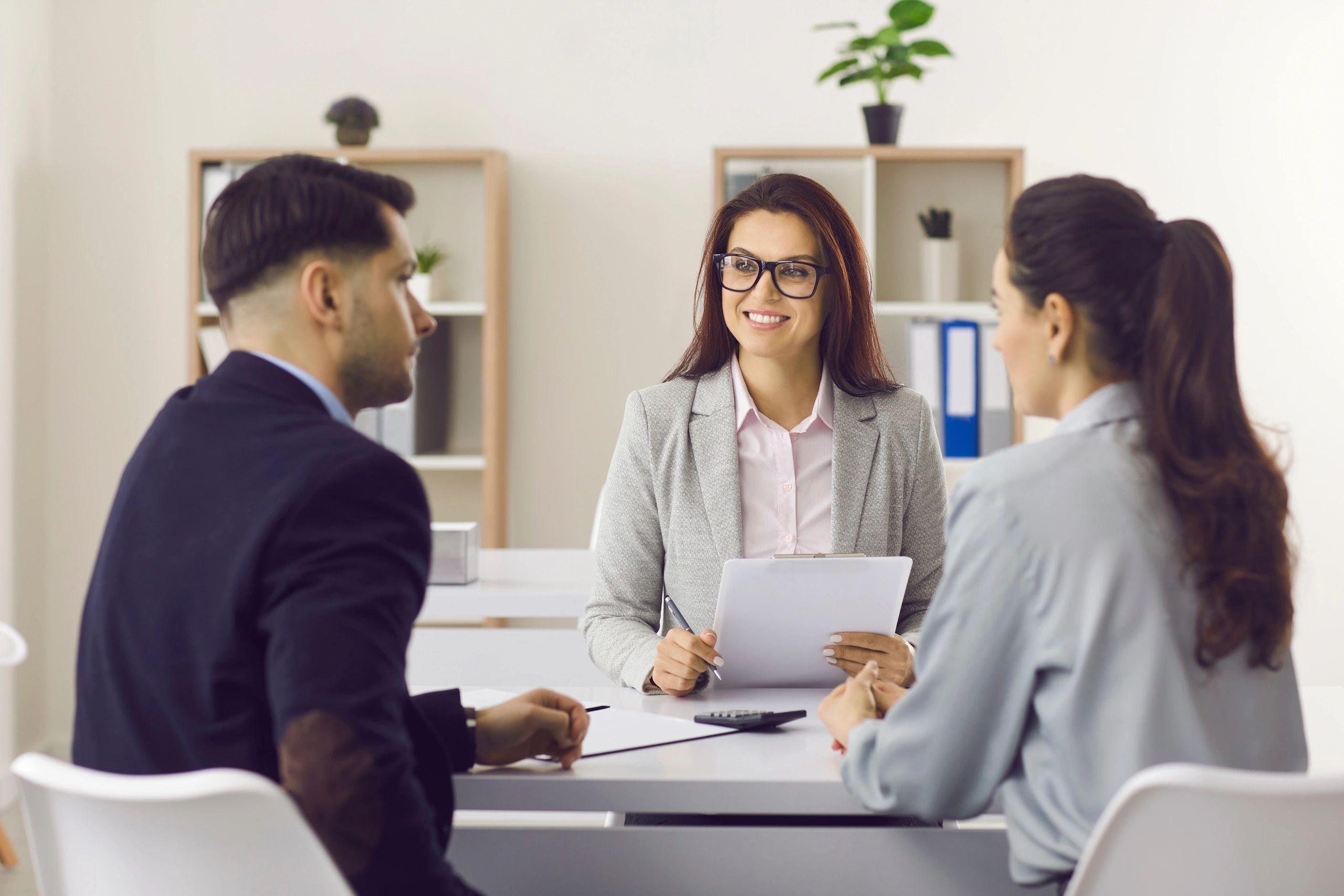 Mortgage adviser meeting home buyers to discuss their property purchase